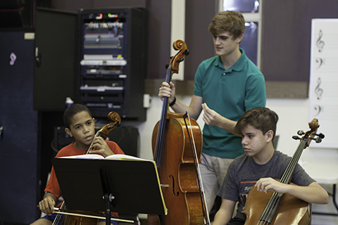 Frost School of Music students working with children